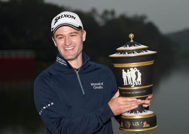 Russell Knox  with the winners trophy after the final round of the WGC - HSBC Champions at the Sheshan International Golf Club in Shanghai. Picture: Ross Kinnaird/Getty