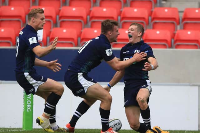 Scotland's Darcy Graham, right, celebrates after scoring what turned out to be the winning try against Australia at the Under-20 World Championship at the AJ Bell Stadium in Salford. Picture: Nigel French/PA Wire
