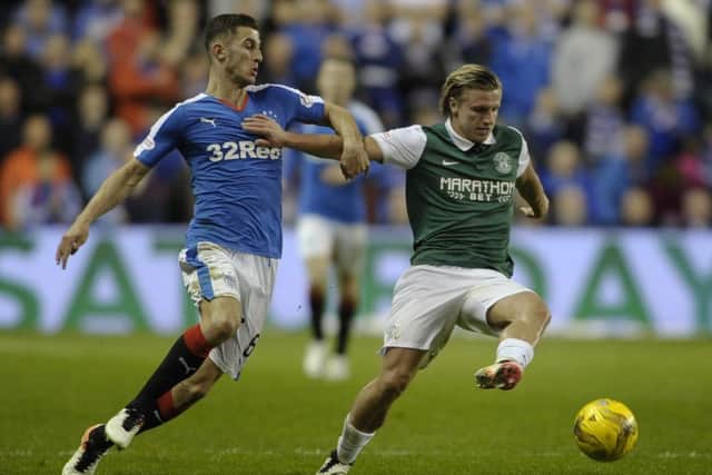 Dominic Ball in action for Rangers against Hibs' Jason Cummings. He was a valuable part of their title-winning team. Picture:
Neil Hanna