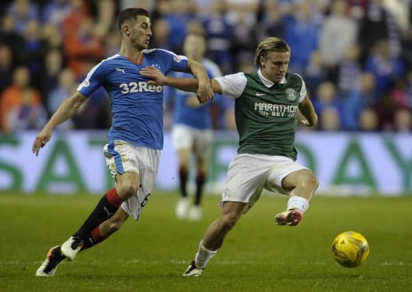 Dominic Ball in action for Rangers against Hibs' Jason Cummings. He was a valuable part of their title-winning team. Picture:
Neil Hanna