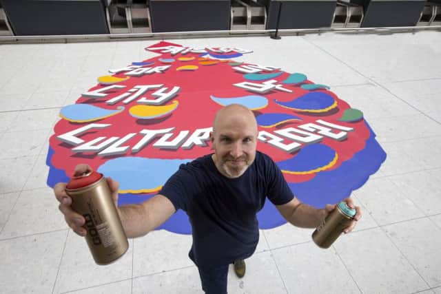 Local artist Duncan Wilson (pictured) is helping to promote Paisley's City of Culture bid with a striking 3D trick of the eye airport within the airport check-in area. Picture: Contributed