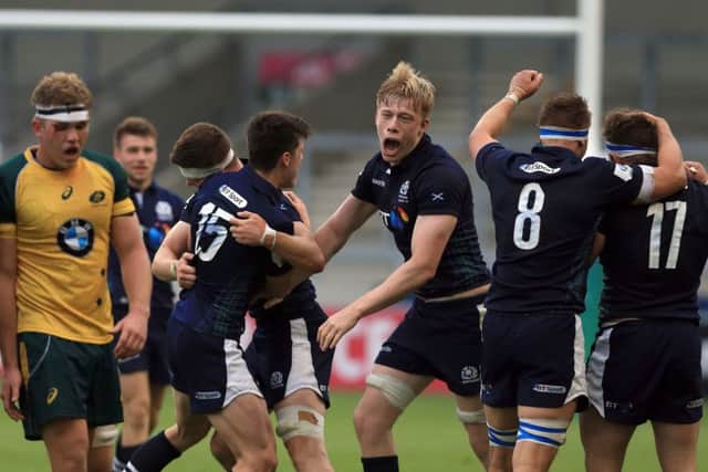 Scotland's Andrew Davidson, centre, celebrates after his side's victory over Australia during the World Rugby U20 Championship. Picture: Clint Hughes/Getty