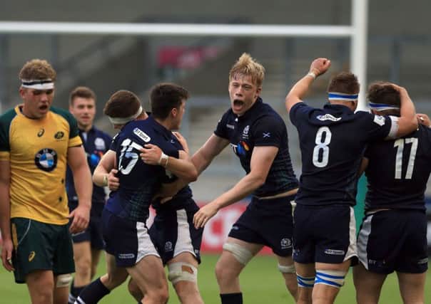 Scotland's Andrew Davidson, centre, celebrates after his side's victory over Australia during the World Rugby U20 Championship. Picture: Clint Hughes/Getty