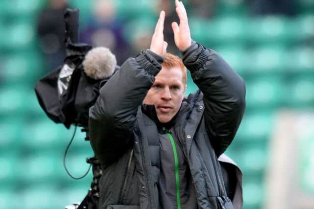 Then
Celtic manager Neil Lennon applauds the travelling fans at full time after a 4-0 win at Easter Road in 2014. Picture: Craig Williamson