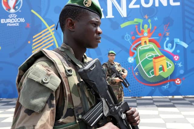 A French soldier patrols in the fan zone in Nice before the start of the Euro 2016 championships. Picture: Valery Hache/AFP/Getty