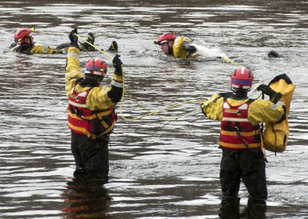 Firefighters from the specialist water rescue team conduct a training exercise involving swimming to a casualty such as the rescue in Perth. Picture: Scottish Fire and Rescue Service