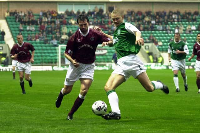 Stephane Adam and Ulrik Laursen tussle in an Edinburrgh Derby. Picture: Bill Henry