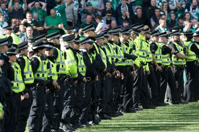 Police line the pitch during the Scottish Cup Final at Hampden. Picture Robert Perry
