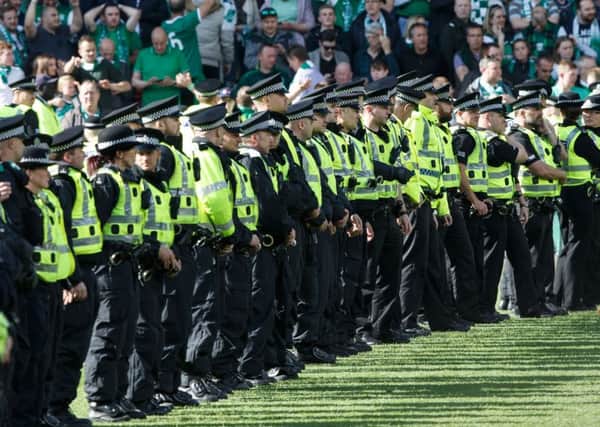 Police line the pitch during the Scottish Cup Final at Hampden. Picture Robert Perry