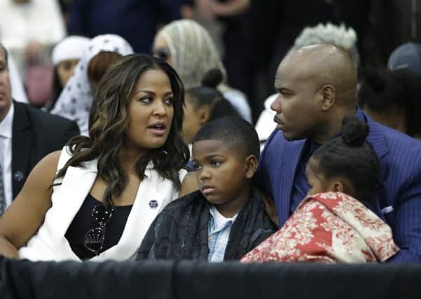 Laila Ali speaks to her husband Custis Conway during Muhammad Ali's Jenazah, a traditional Islamic Muslim service, in Freedom Hall, Thursday, June 9, 2016, in Louisville, Ky. Picture: AP
