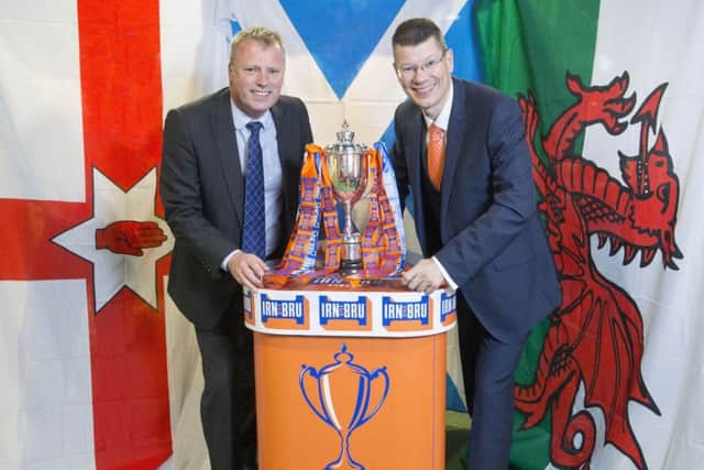 The new Irn-Bru Cup is launched by Adrian Troy from AG Barr, left, and SPFL chief executive Neil Doncaster. Picture: Jeff Holmes