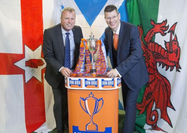 The new Irn-Bru Cup is launched by Adrian Troy from AG Barr, left, and SPFL chief executive Neil Doncaster. Picture: Jeff Holmes