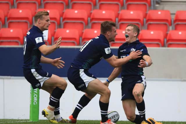 Scotland's Darcy Graham, right, celebrates his winning try against Australia. Picture: Nigel French/PA Wire