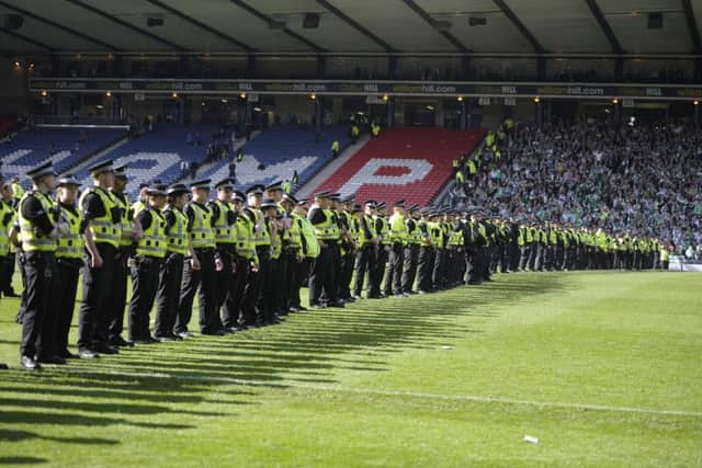 Fans clashed during the Scottish Cup final between Hibs and Rangers. Picture: Neil Hanna