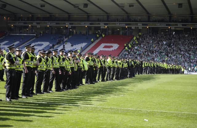 Fans clashed during the Scottish Cup final between Hibs and Rangers. Picture: Neil Hanna