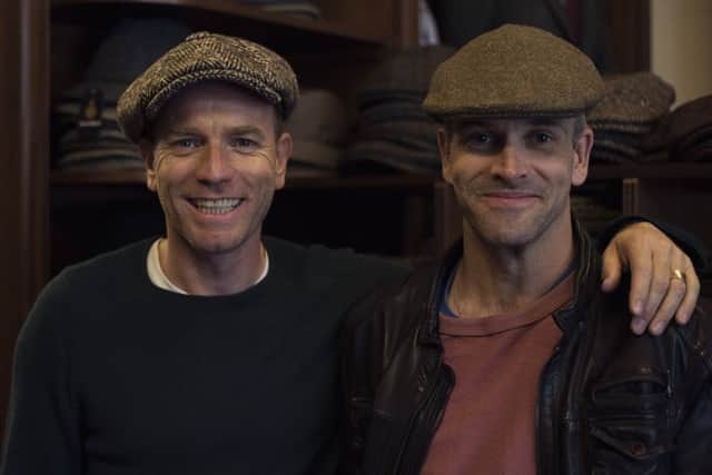 Ewan McGregor and Johnny Lee Miller try out some tweed bunnets. Picture: Kristie De Garis