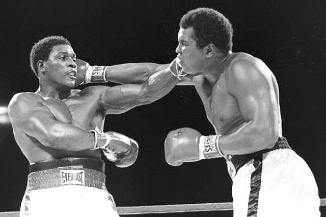 Trevor Berbick, left, and Muhammad Ali trade blows in Nassau during what turned out to be Ali's last bout. Picture: AP