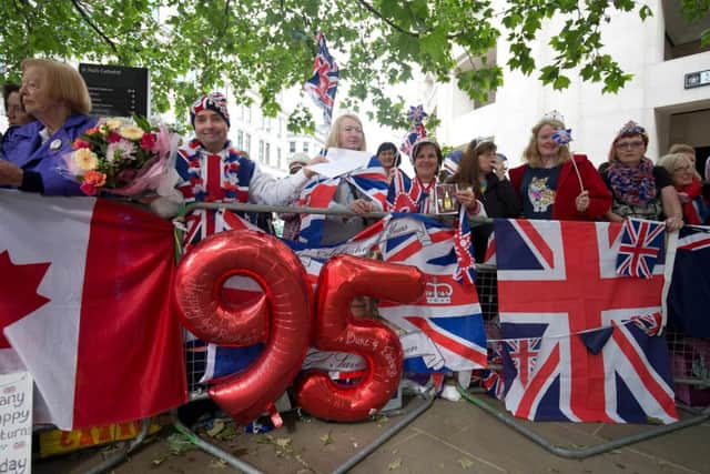 Royal fans line the barriers ahead of service of thanksgiving for the 90th birthday of Britain's Queen Elizabeth II at St Paul's Cathedral. Picture: Getty