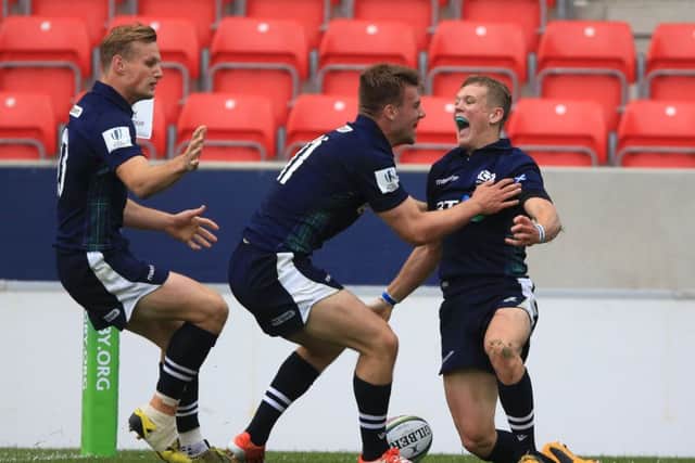 Scotland's Darcy Graham, right, celebrates his wonderful try against Australia during the Under-20 Rugby World Cup. Picture: Nigel French/PA Wire