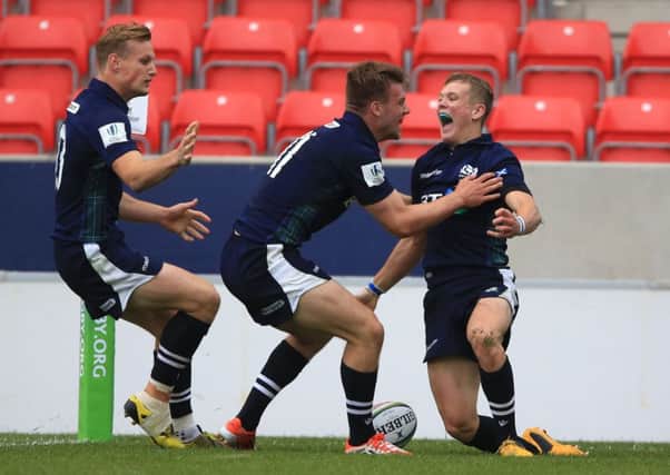 Scotland's Darcy Graham, right, celebrates his wonderful try against Australia during the Under-20 Rugby World Cup. Picture: Nigel French/PA Wire