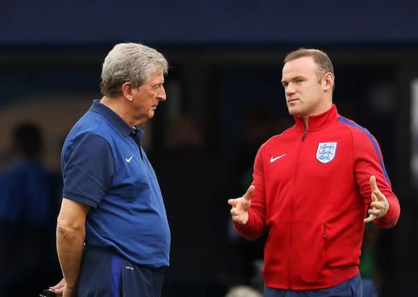 England manager Roy Hodgson chats to Wayne Rooney on the pitch at Marseille's Stade Velodrome. Picture: PA