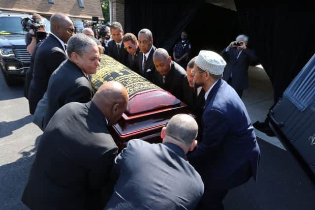 The coffin is carried out of the prayer meeting. Picture: Michael Clevenger/The Courier-Journal