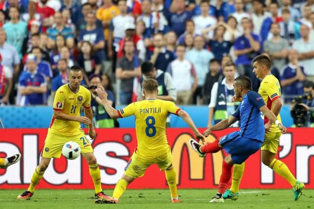 France's Dimitri Payet scores his side's late second goal during the Euro 2016 opening match against Romania. Picture: Chris Radburn/PA Wire