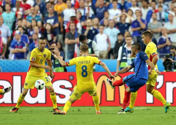 France's Dimitri Payet scores his side's late second goal during the Euro 2016 opening match against Romania. Picture: Chris Radburn/PA Wire