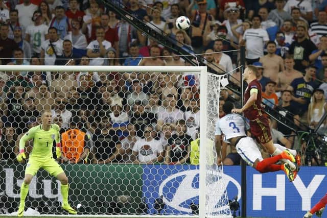Russias Vasili Berezutski, right, soars to head home the late equaliser in Marseille. Picture: Kirsty Wigglesworth/AP