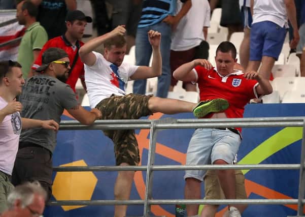 Tempers flare in the stands between Russia and England fans. Picture: Nick Potts/PA Wire