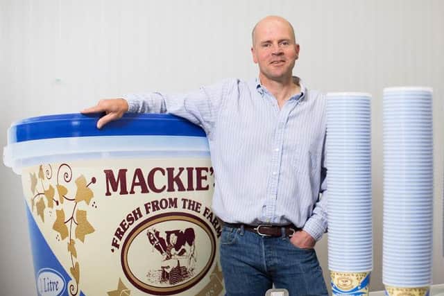 Managing director Mac Mackie with the firm's vintage ice cream tubs. Picture: Ross Johnston/Newsline Media