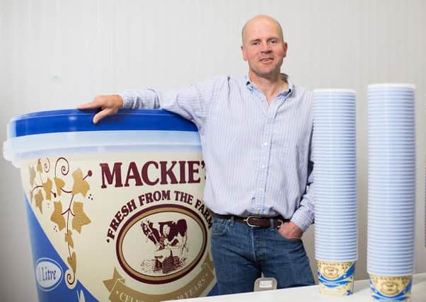 Managing director Mac Mackie with the firm's vintage ice cream tubs. Picture: Ross Johnston/Newsline Media