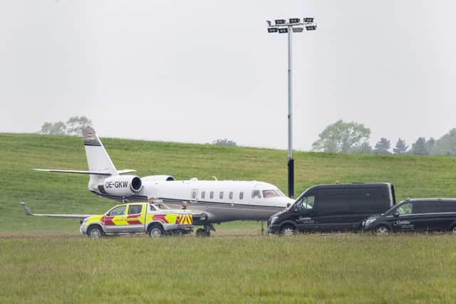 Stephanie Inglis arrives at Edinburgh Airport where she was met by an ambulance. Picture: SWNS
