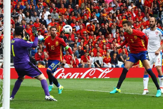 Gerard Pique heads the ball past Petr Cech for the only goal of the game. Picture: Getty