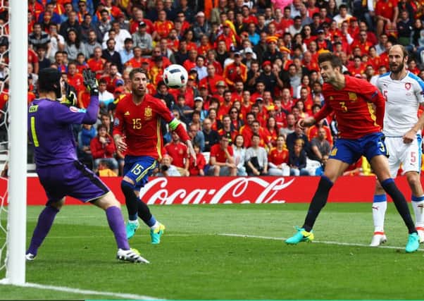 Gerard Pique heads the ball past Petr Cech for the only goal of the game. Picture: Getty