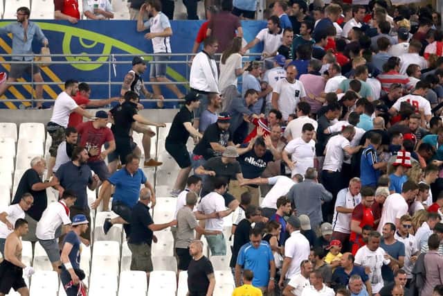 Tempers flare between Russia and England fans in the stands at the Stade Velodrome, Marseille. Picture: PA