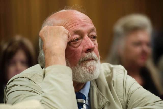 Barry Steenkamp, father of the late Reeva Steenkamp, looks on after testifying at the Pretoria High Court. Picture: Getty Images