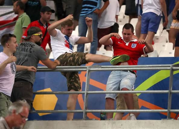 A Russian fan kicks out at an England supporter after Saturdays game between the teams at the Stade Velodrome. Picture: PA