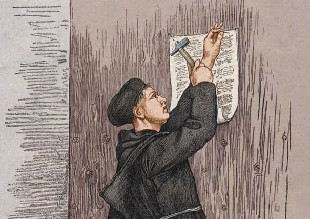 Engraving shows German theologian Martin Luther (1483 - 1546) as he nails the 'Disputation of Martin Luther on the Power and Efficacy of Indulgences' (or the 95 Theses) to the church door in Wittenberg, Germany, October 31, 1517. Picture: Stock Montage/Getty Images