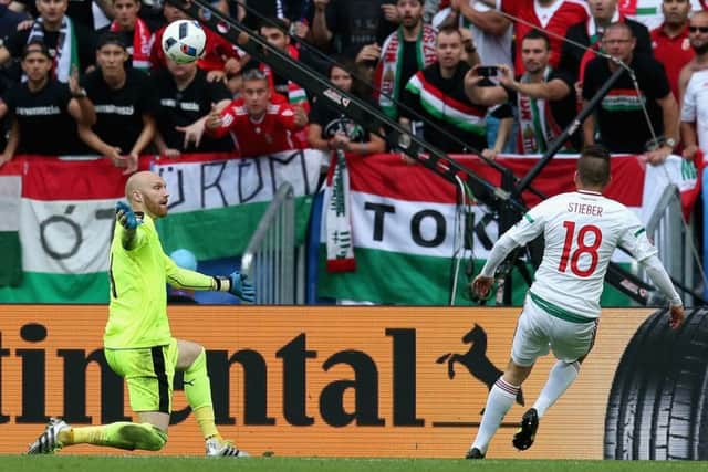 Zoltan Stieber of Hungary lifts the ball over Austria goalkeeper Robert Almer to scores his team's second goal in the Group F win in Bordeaux. Picture: Boris Streubel//UEFA via Getty Images