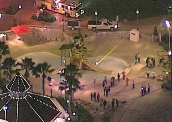 Rescuers gather nears the spot where the toddler disappeared after being taken by the alligator as the search continued through the night. Picture: AP