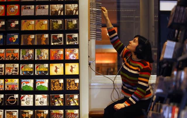 A customer listens to featured albums in one of the upstairs booths in the Rose Street branch of Fopp in 2004. Picture: Neil Hanna/TSPL