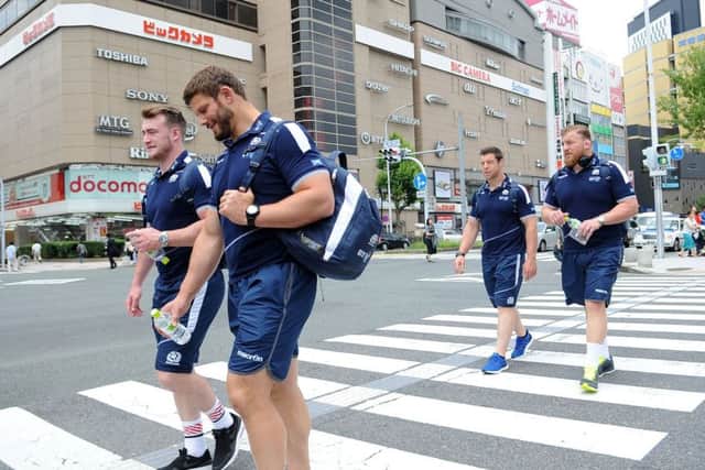 Scotland players Stuart Hogg,left, Ross Ford, Alasdair Dickinson and Moray Low take in the sights during a short walk to the team bus outside Nagoya railway station. Picture: David Gibson/Fotosport