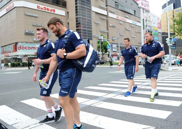 Scotland players Stuart Hogg,left, Ross Ford, Alasdair Dickinson and Moray Low take in the sights during a short walk to the team bus outside Nagoya railway station. Picture: David Gibson/Fotosport