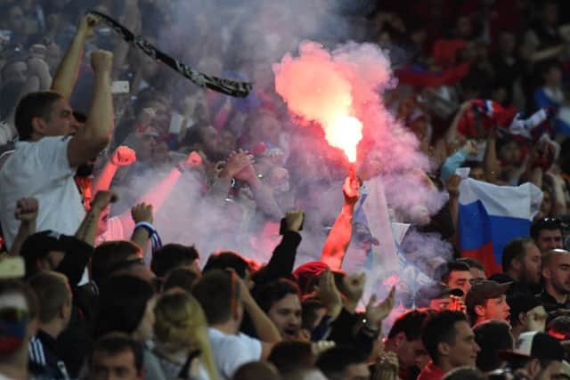 Russia supporters celebrate after Denis Glushakov's goal in the 2-1 defeat by Slovakia. Picture: Geert Vanden Wijngaert/AP