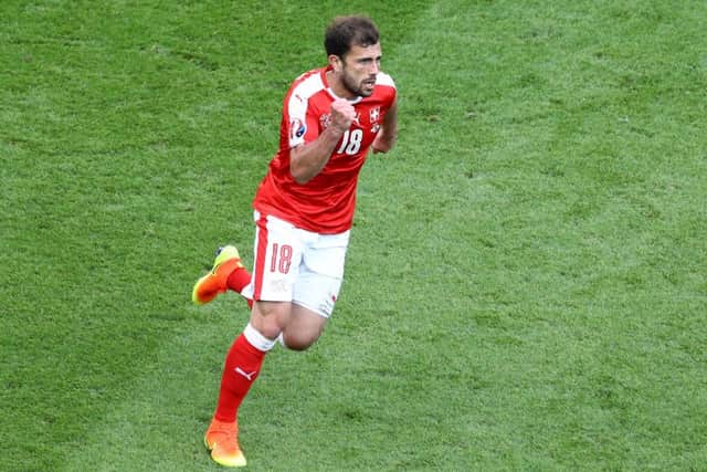 Admir Mehmedi celebrates after scoring Switzerland's equaliser against Romania at Parc des Princes. Picture: Paul Gilham/Getty Images