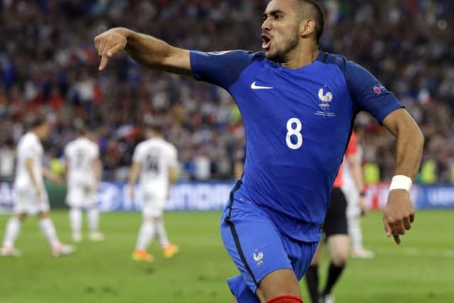 Dimitri Payet celebrates after scoring France's second goal against Albania. Picture: Thanassis Stavrakis/AP