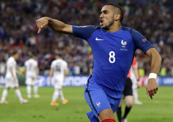 Dimitri Payet celebrates after scoring France's second goal  against Albania. Picture: Thanassis Stavrakis/AP