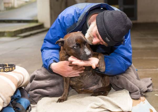 The plight of a beggars dog  for many years a popular fixture just off Kirkcaldys High Street  has united the community and led to nearly Â£1000 in donations.  Picture: HE Media