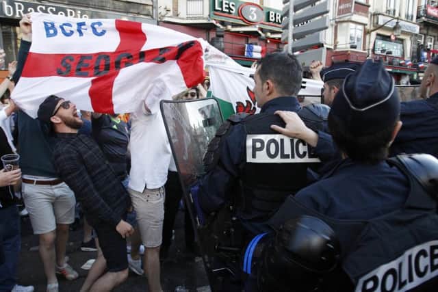 England fans gather outside a bar in Lille. Picture: AP